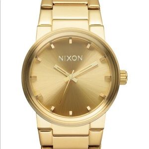 Gold authentic Nixon men’s watch. Links included