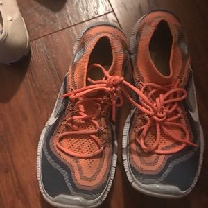 Orange Nike free runs