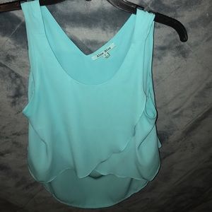 Turquoise flowy top.