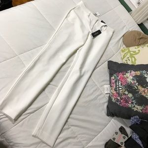 Express mid rise skinny pants in white.