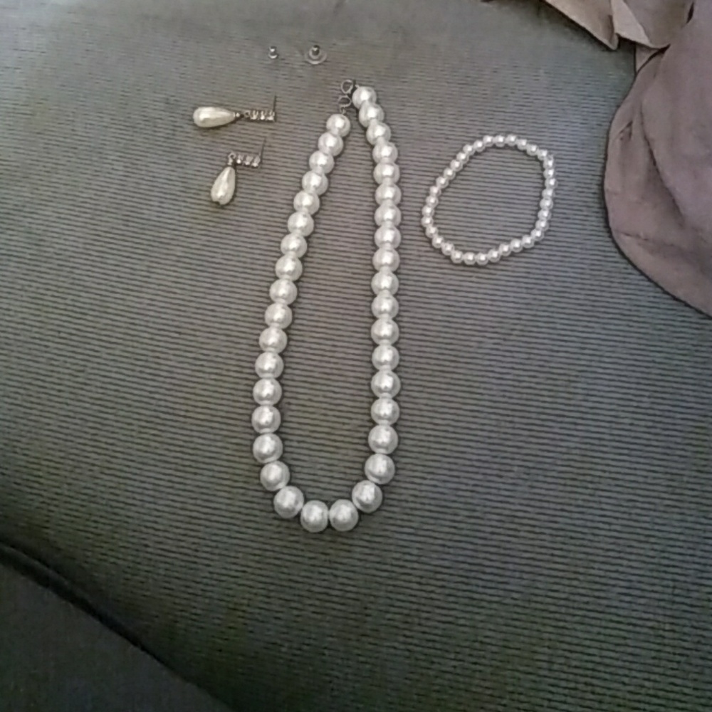 A pearl necklace bracelet and earrings not a set