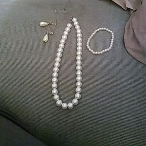 A pearl necklace bracelet and earrings not a set