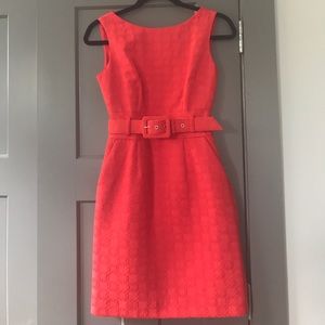 Belted shift dress with red brocade print; lined.