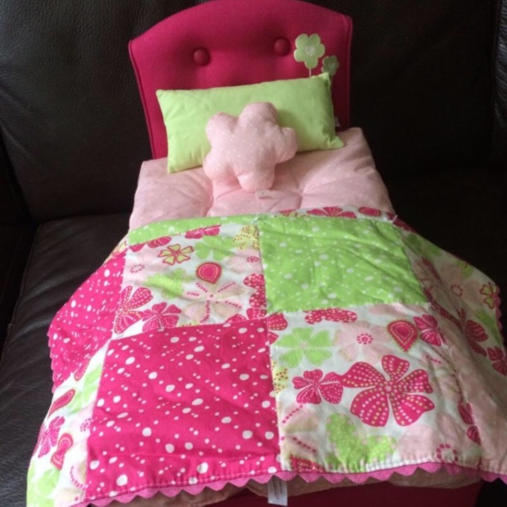 American Girl bed with blanket and pillow