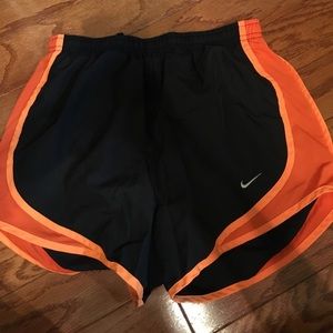 Orange and black Nike shorts