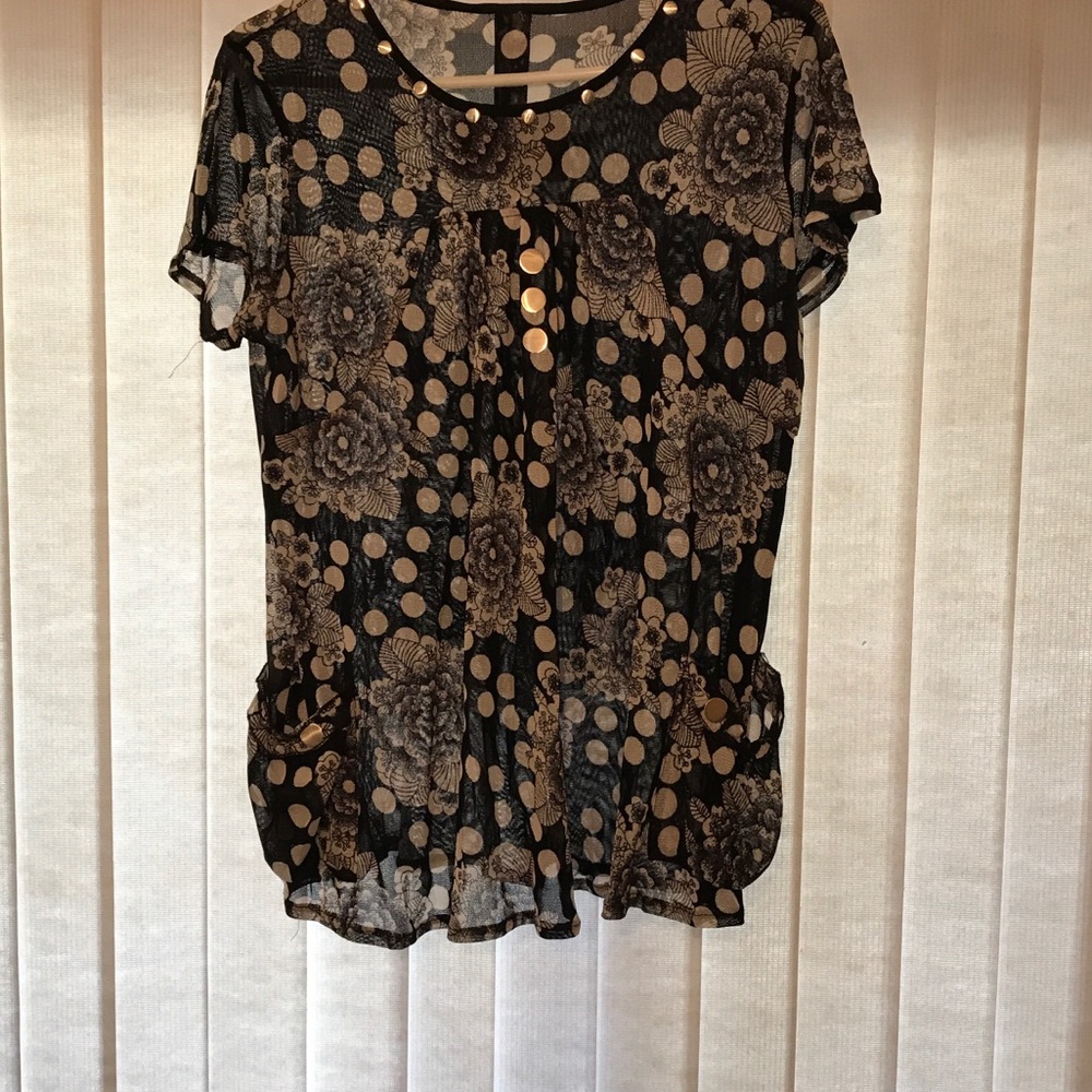 Woman’s black and white see through blouse