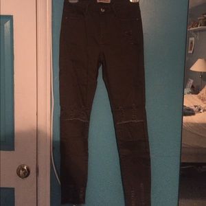 Khaki low rise distressed skinny jeans