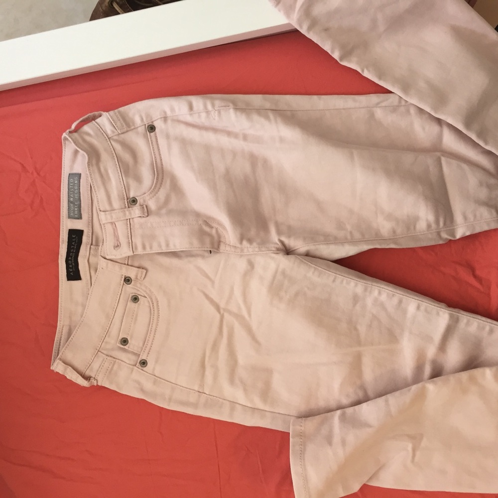 Pale pink skinny jeans