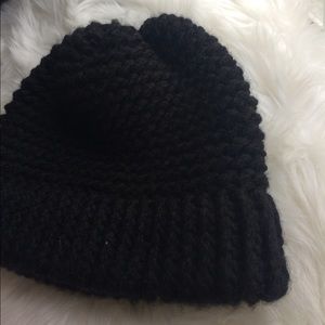 Black hand-knitted winter hat