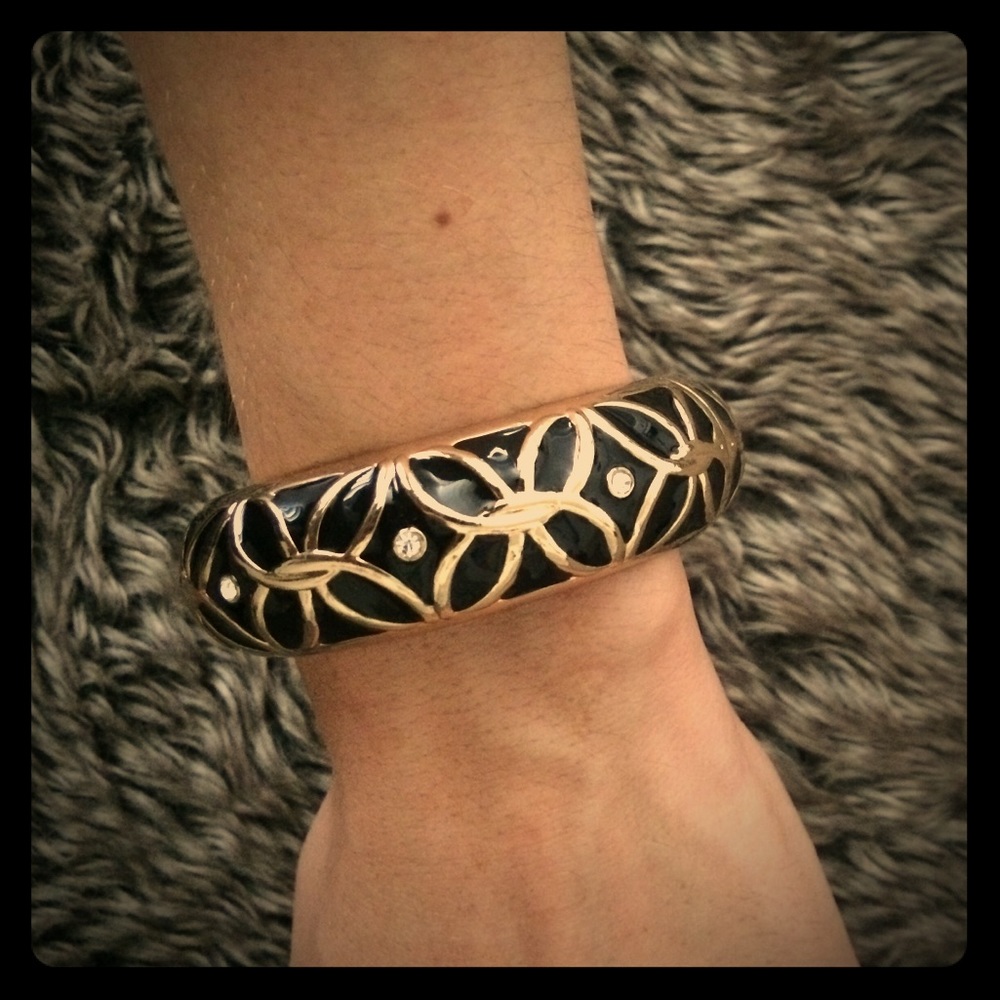 Gold and black bangle with rhinestone accent
