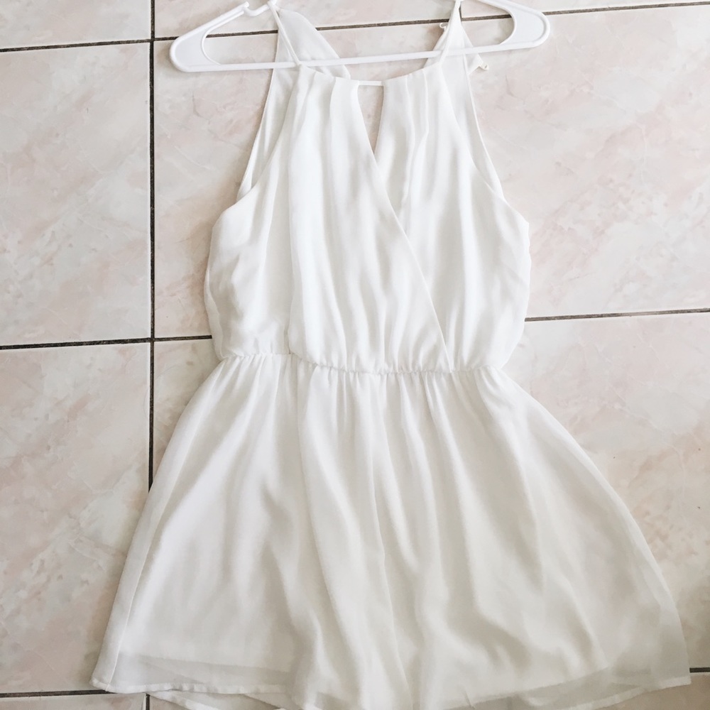 Super cute white open hole romper