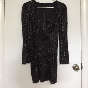 Black sequin mini low cut dress