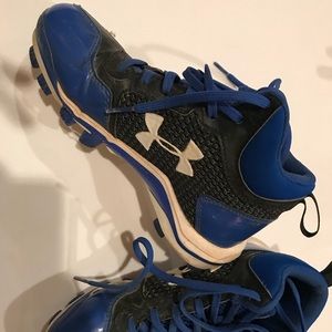 Kids under armor baseball/football cleats.