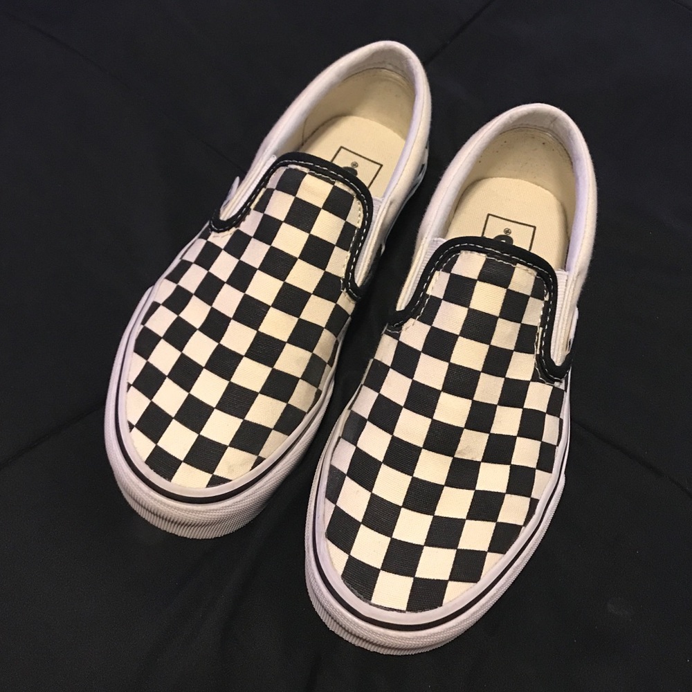 Checkered black and white slip-on shoes