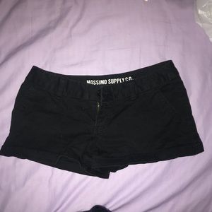 Black shorts, button back pockets