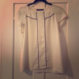 White blouse with black piping