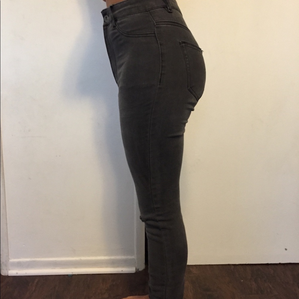 Gray high waisted jeans ripped at the knee
