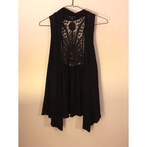 Black vest with crocheted design on back