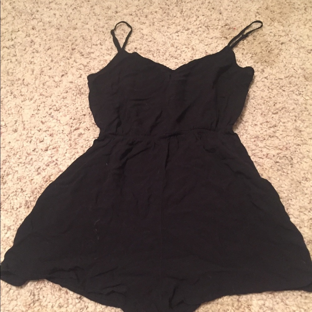 Size small romper with pockets, and cross back :)