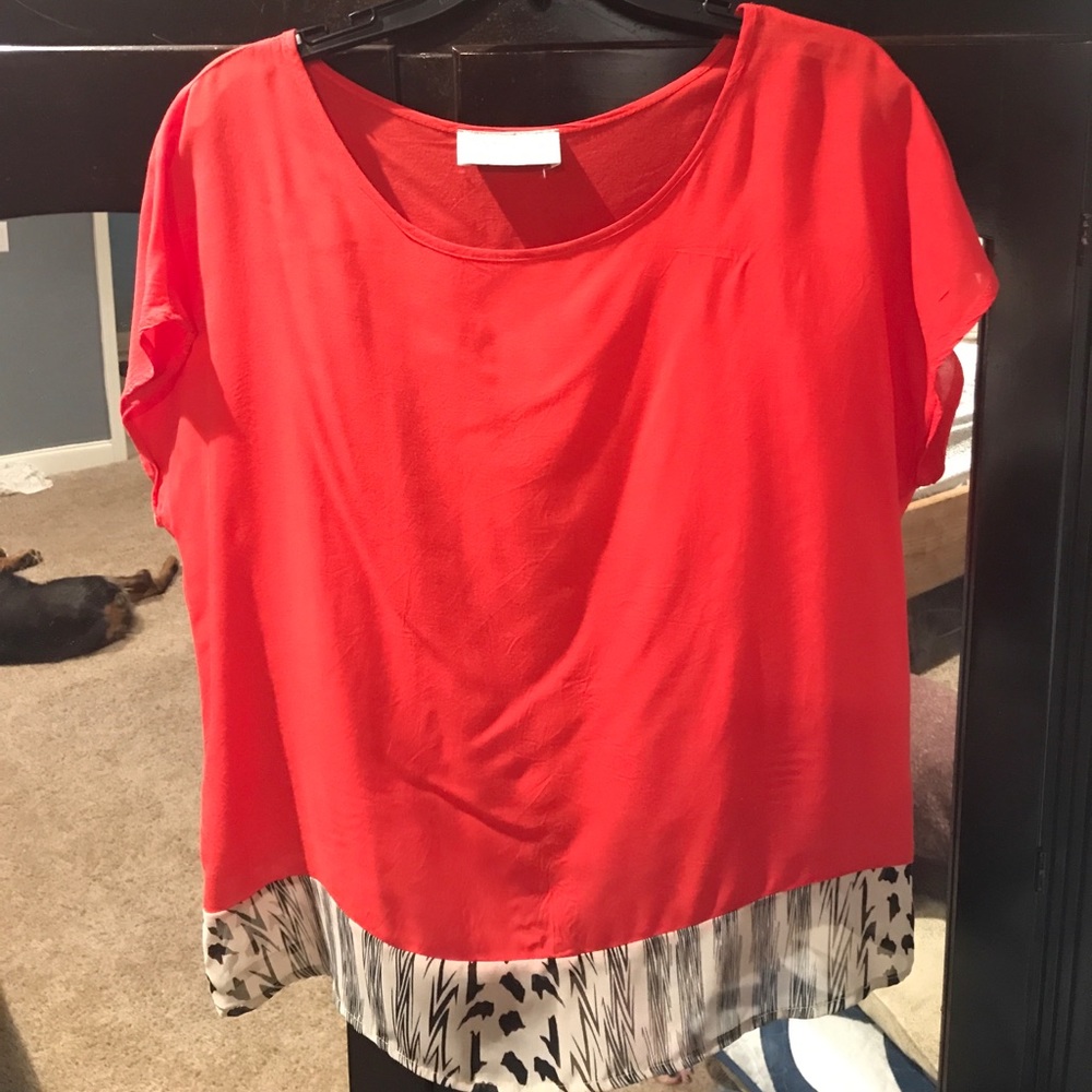 Size S red top with animal print accents