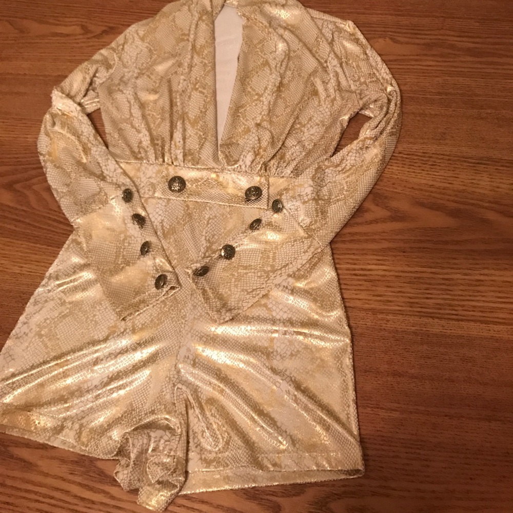 A gold and snake skin jump suit with shimmer