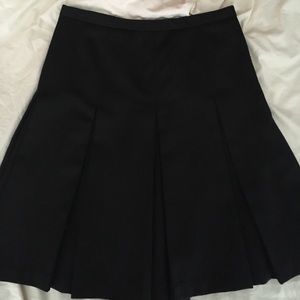 Black pleated a-line knee length skirt