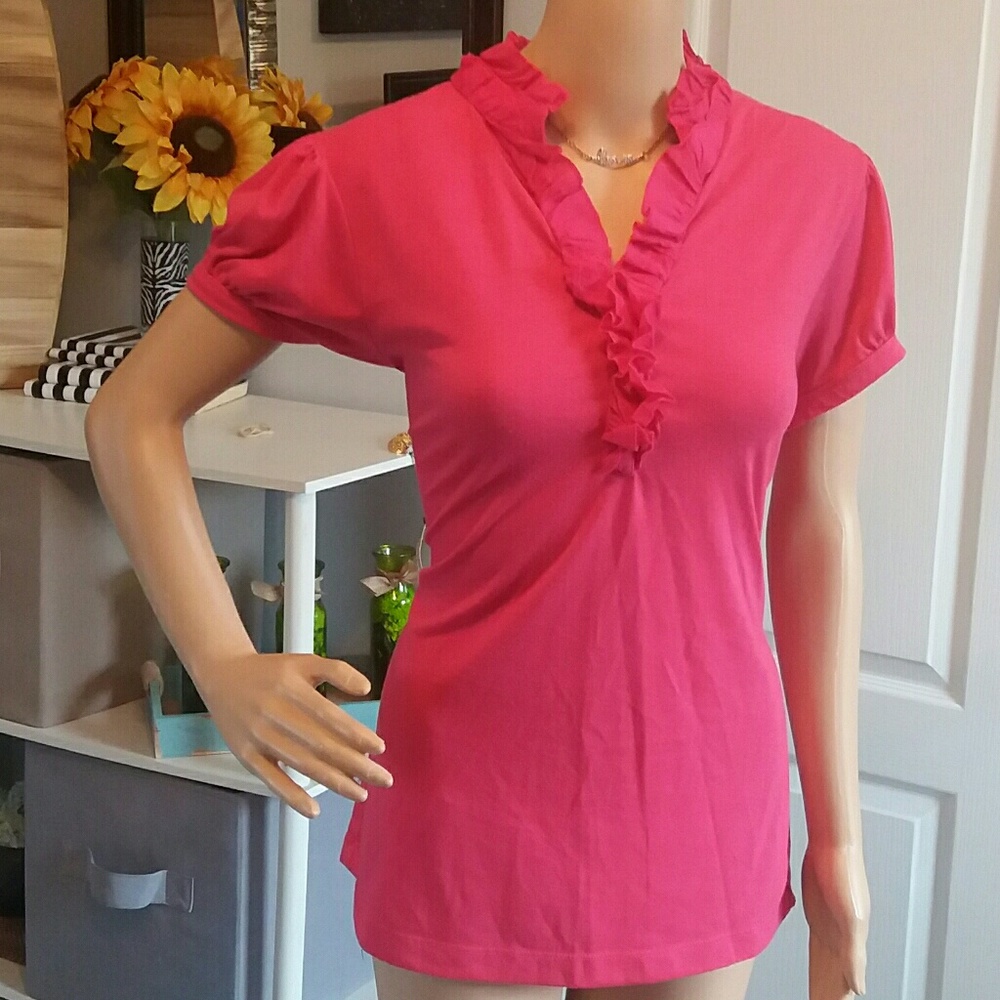 Pink shirt with buttons and ruffle detail