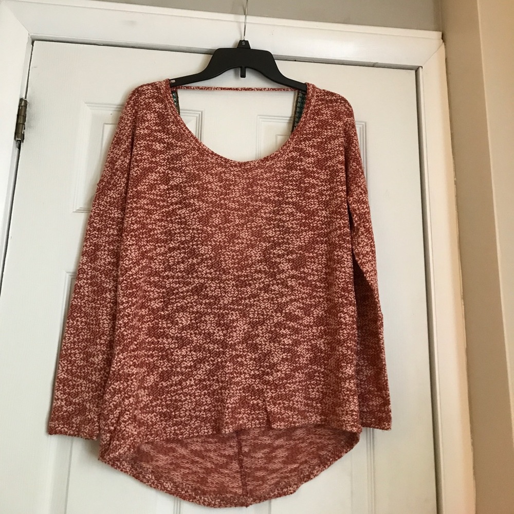 Red and white sweater with open back