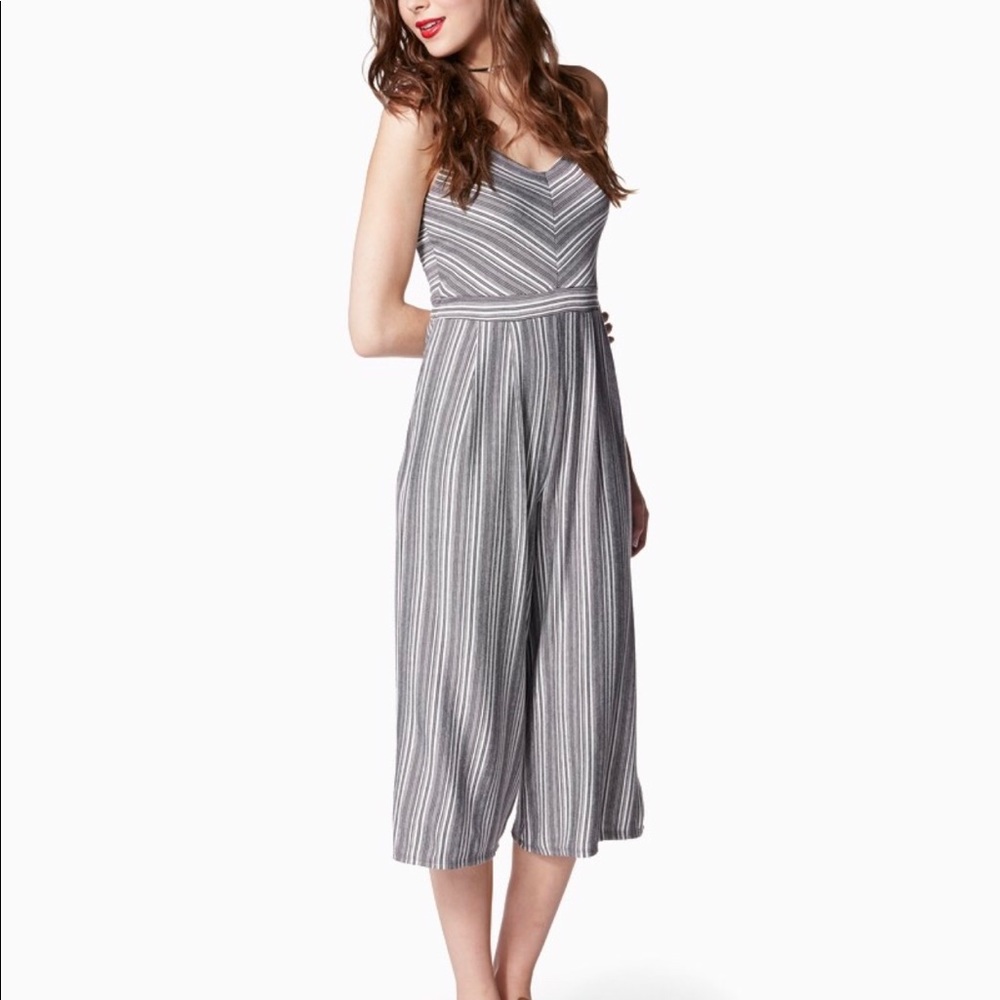 Charming Charlie black and white striped jumpsuit