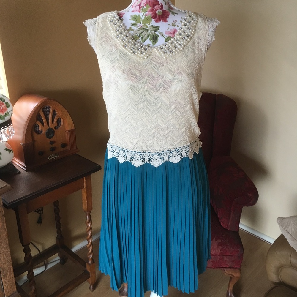 Vintage style dress with pearl accents.