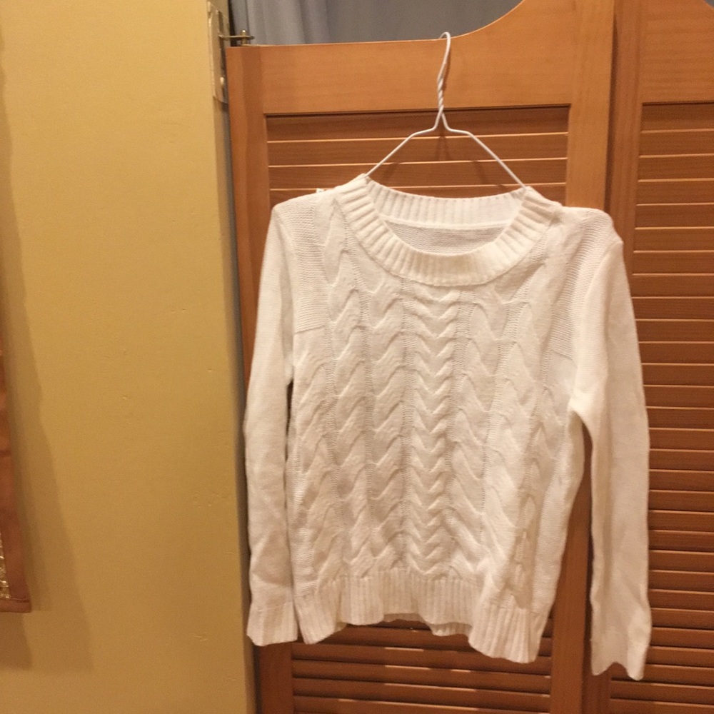 White cable knit sweater.