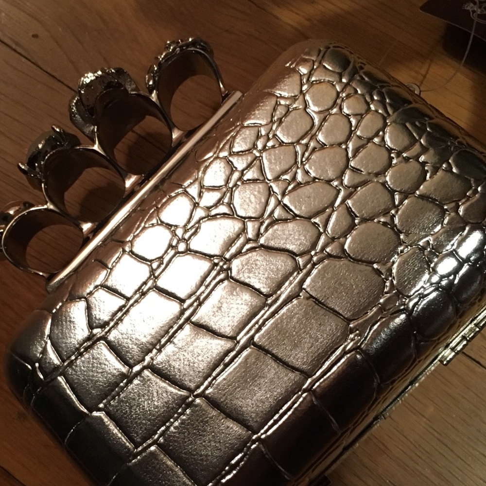 Silver mini clutch with knuckle detail