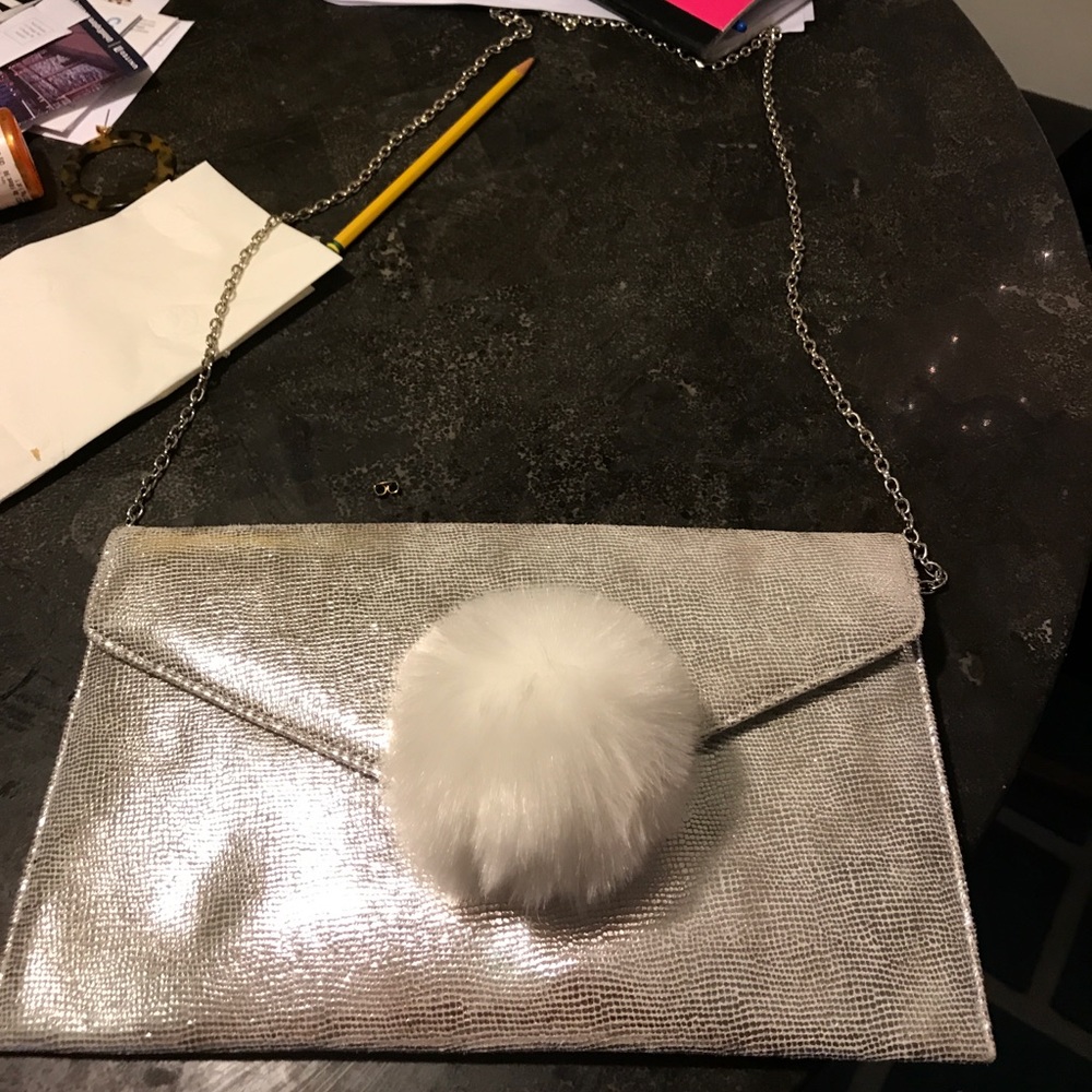 BRAND NEW SILVER POM POM PURSE
