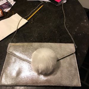 BRAND NEW SILVER POM POM PURSE