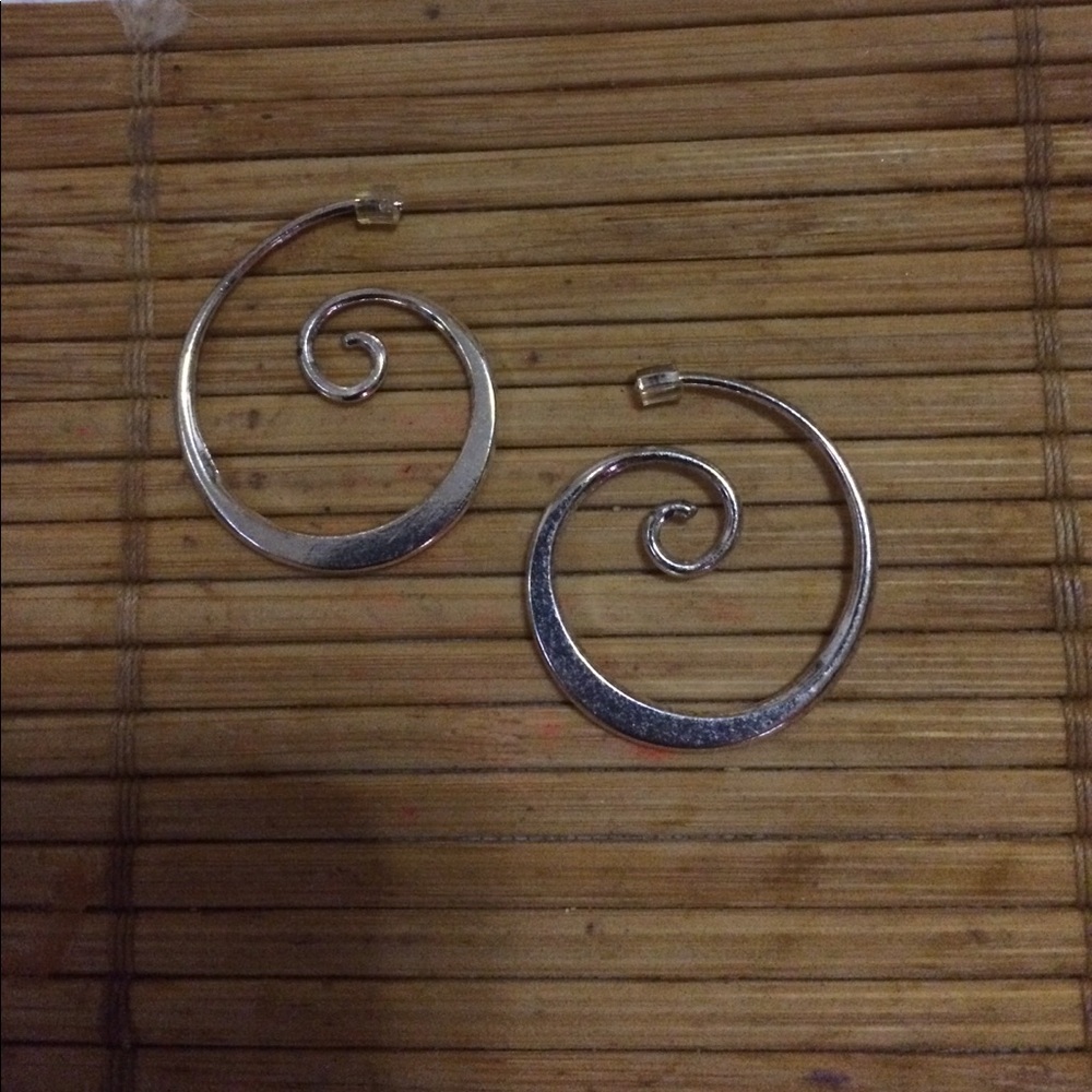 Silver swirl hoop earrings.
