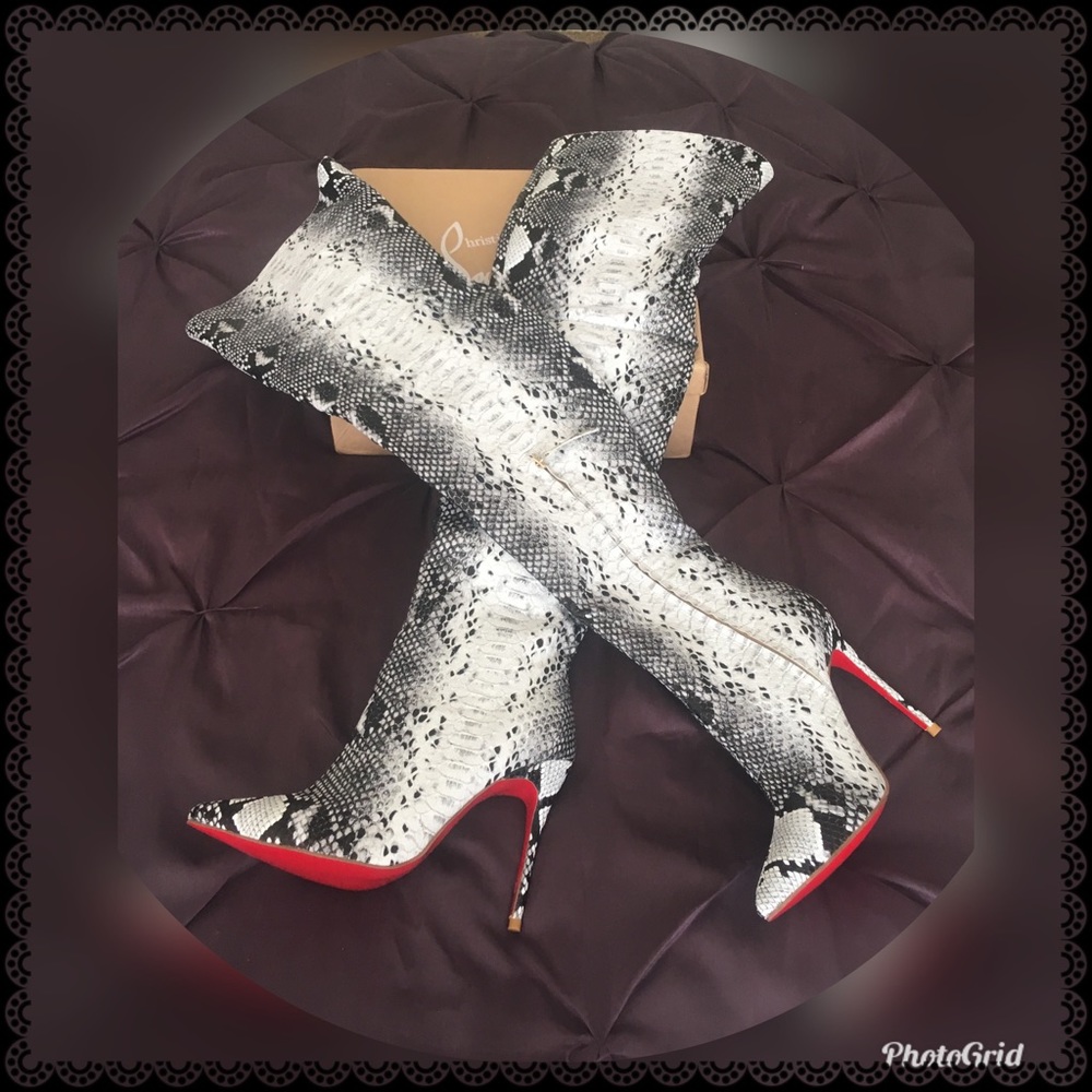 Knee-high black and white snakeskin boots