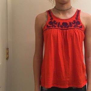orange tank top w/ floral patterns