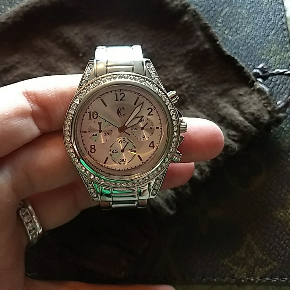 Silver diamond clasp watch.