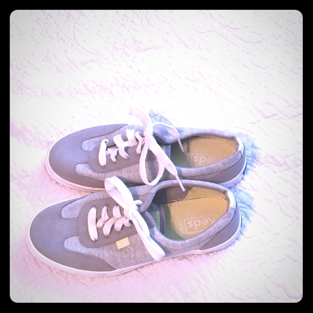 Light gray Keds with bright yellow insole