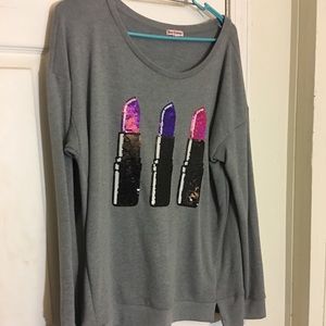 Grey sweater with lipstick tubes