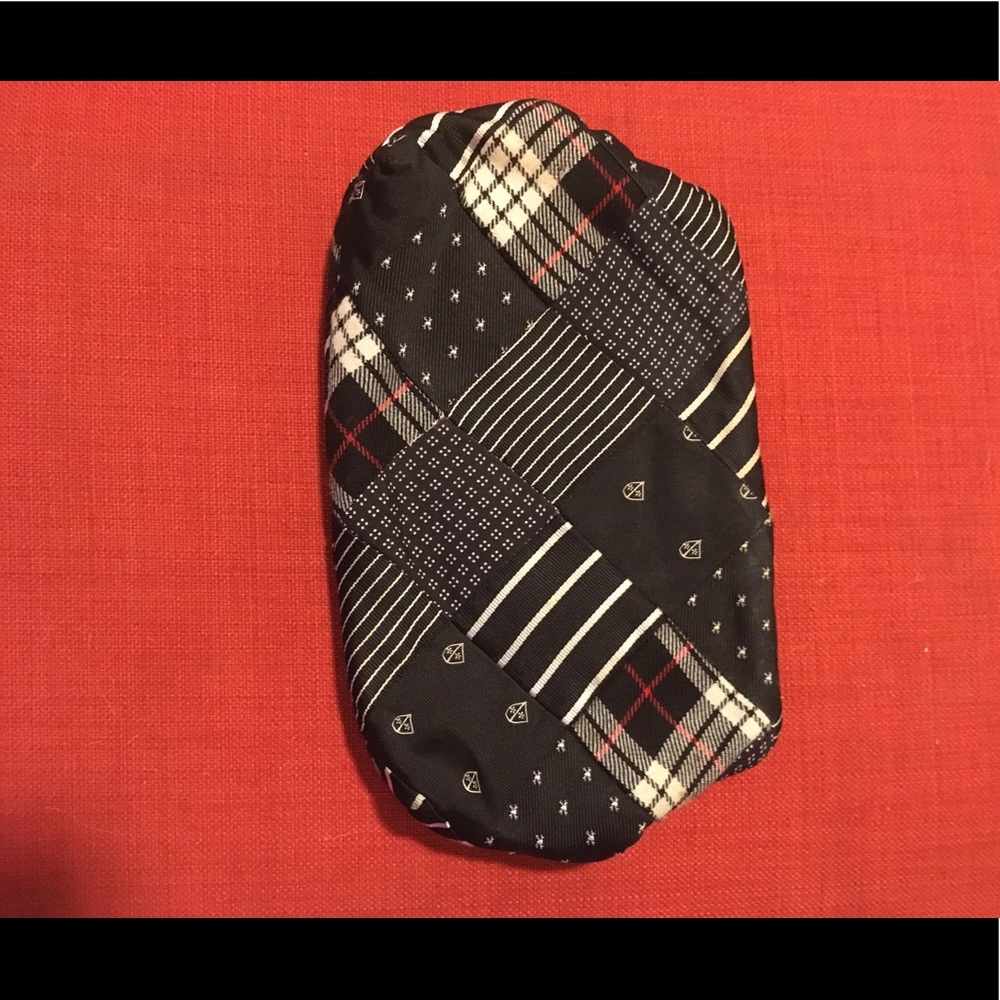 JCrew clutch made from ties. Mostly navy blue.