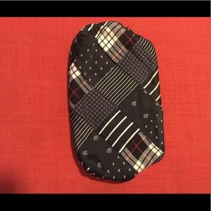 JCrew clutch made from ties. Mostly navy blue.