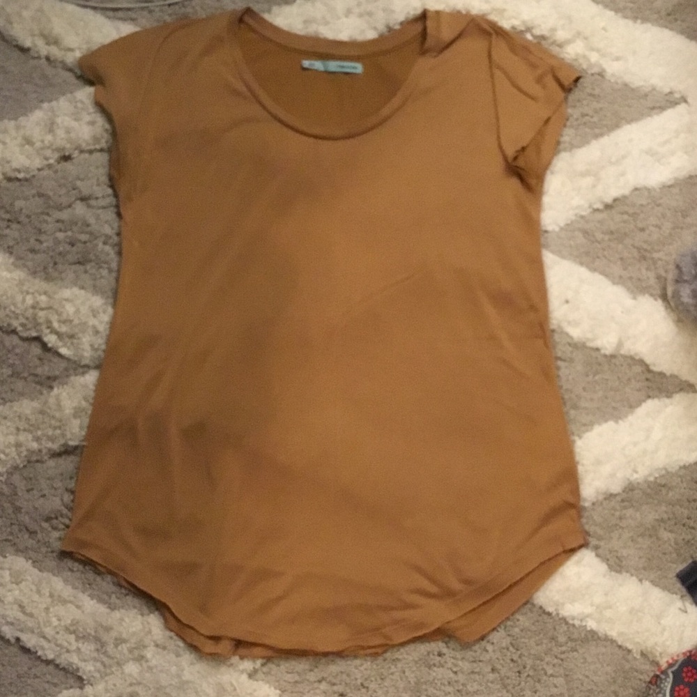 Yellow mustard Maurice's shirt