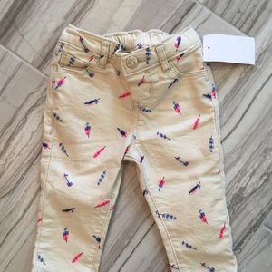 Oshkosh baby b’gosh feather jeans. 9M.  NWT.