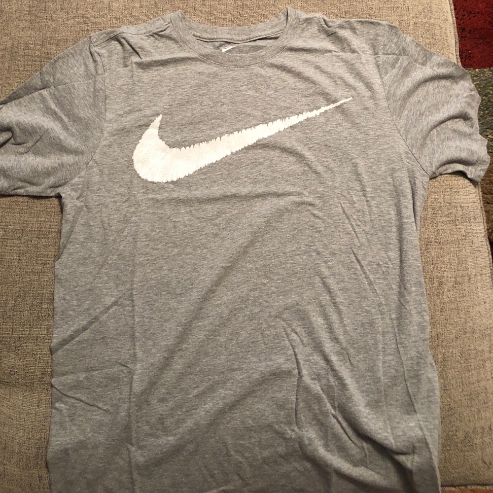 Grey Nike T with whitish/grey swoosh. Size M