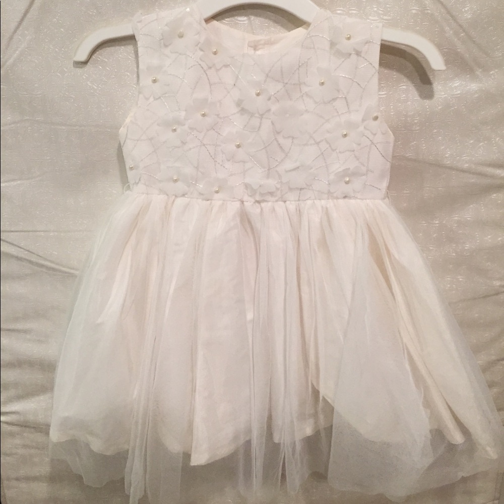 Girls dress with beaded flowers