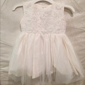 Girls dress with beaded flowers