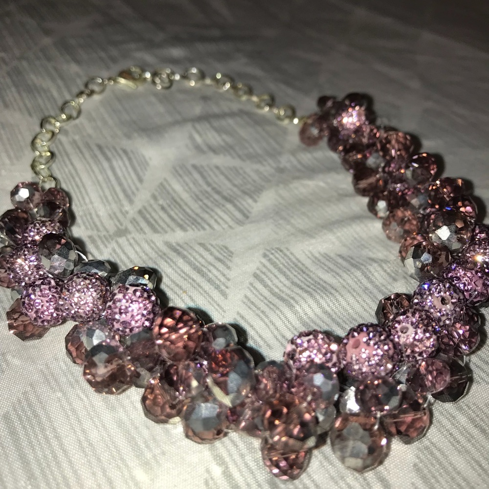 Purple beaded necklace with silver hardware