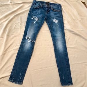 Express skinny jeans with pocket embellishments