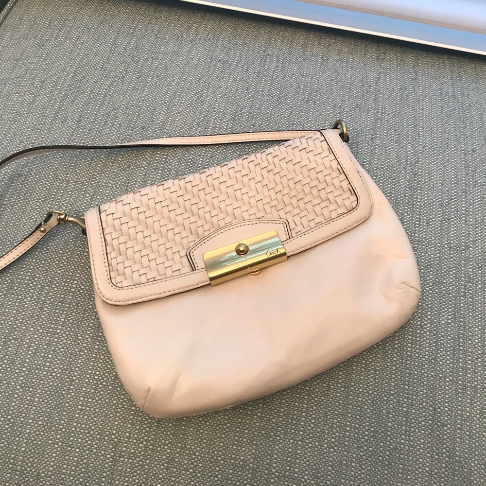 COACH  white bag with gold detail.